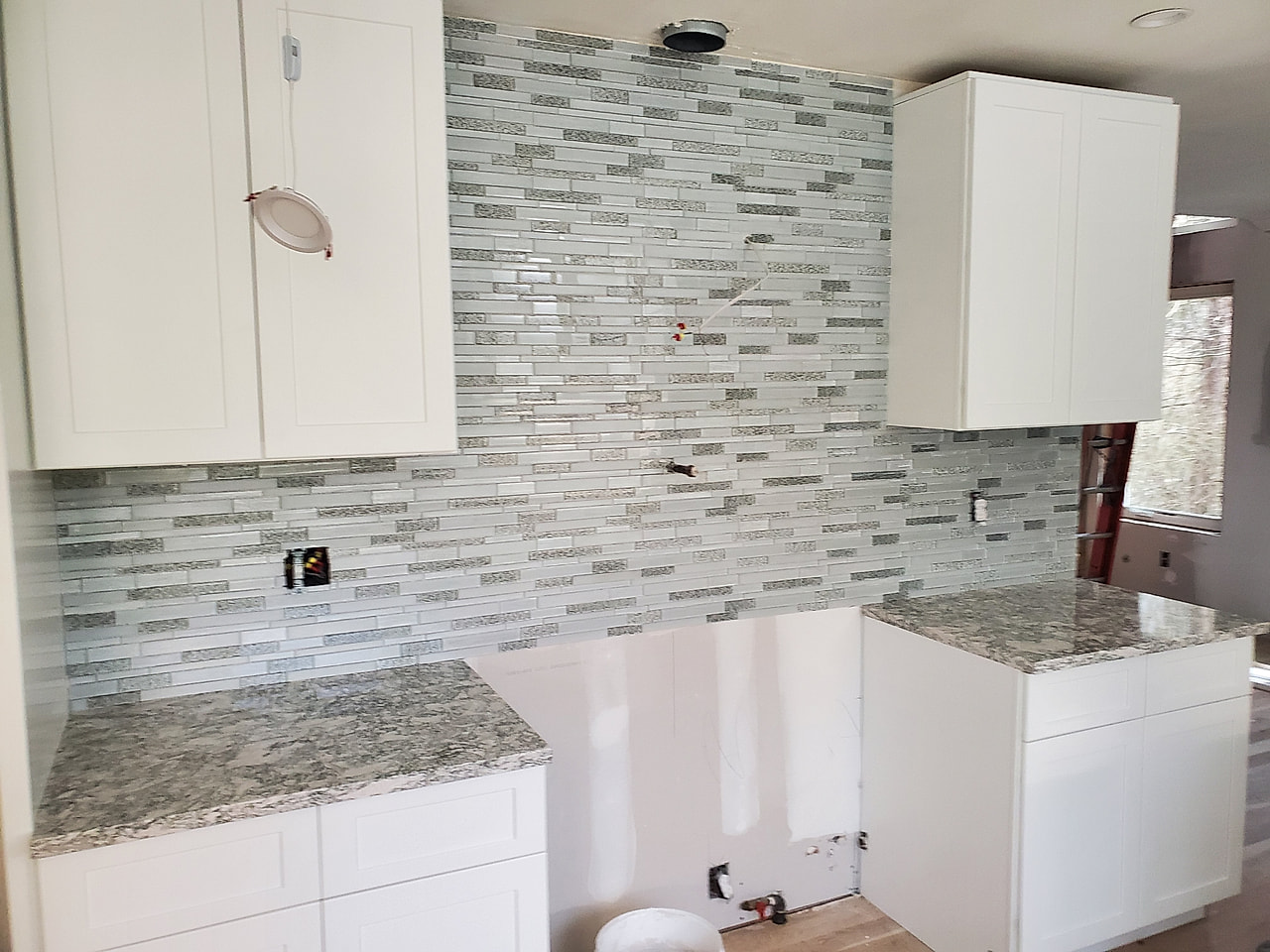 Linear glass-mosaic backsplash