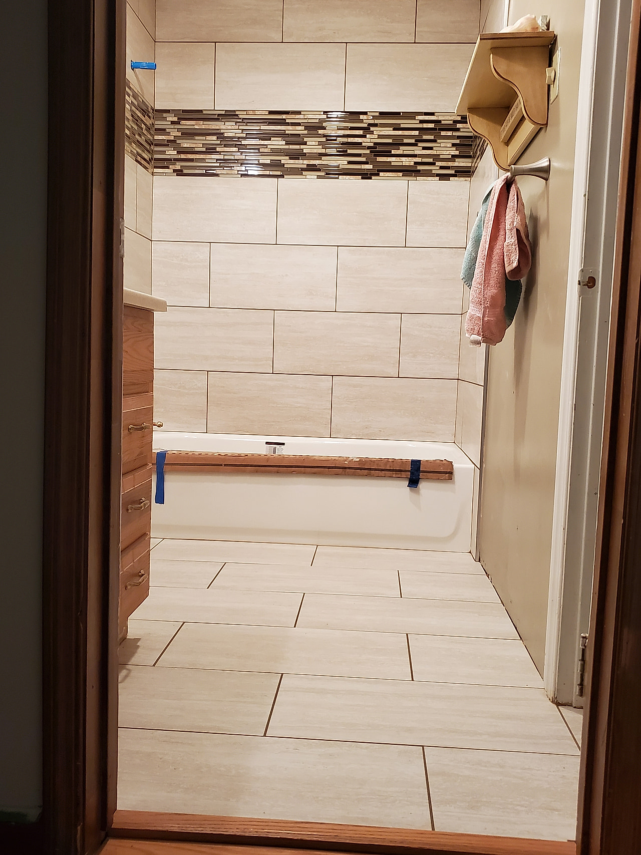 Mosaic accent strip in shower